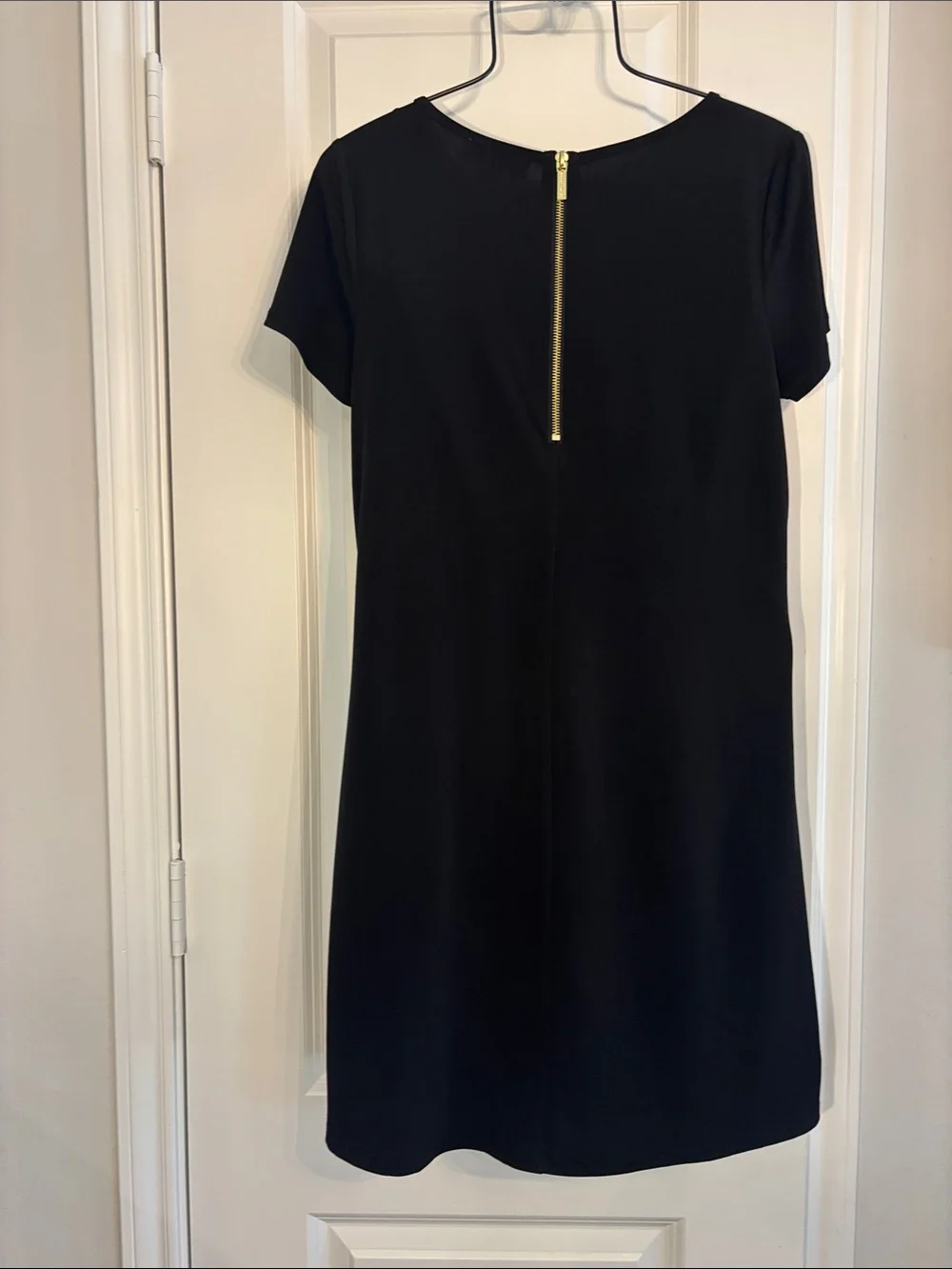 Michael Kors classic black short sleeve A-line with gold zipper mini dress. S